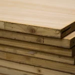 Side view of a stack of blockboards, showing the solid wood core construction and thickness.