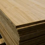 Side view of stacked oak veneered blockboards showing the inner core structure.