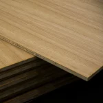 Edge detail of a 19mm oak veneered blockboard panel showing the core layer.
