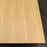 Top-down view of a single oak veneered blockboard sheet with a uniform straight-grain pattern.