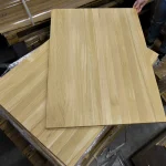 Top view of a solid-lamella oak furniture panel showing its natural wood grain.