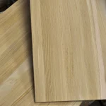 Detailed close-up of the natural wood grain on a grade 1 oak furniture panel.