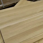Close-up of the natural wood grain texture on a solid oak furniture panel.