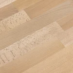 Detailed texture of a finger-jointed beech furniture panel showing natural wood grains.
