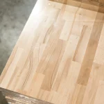 Close-up of the smooth surface of a finger-jointed beech sandwich panel.
