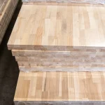 Side view of stacked 40mm beech furniture boards showing the finger-jointed structure.