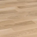 Macro photo of the texture and finger-jointed lamellas of the oak furniture board.