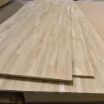 Stack of large 3x1.22m finger-jointed oak panels ready for shipping.