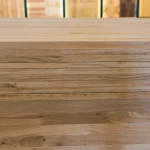 Side profile of stacked finger-jointed oak panels showing the uniform 20mm thickness of each layer.