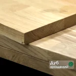 Finger-jointed oak furniture panel with a descriptive label showing the wood type.