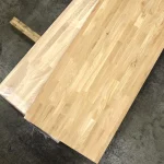 Finger-jointed oak panel measuring 2.25x0.76 m on a warehouse floor.