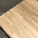 Corner of a grade 2 finger-jointed oak panel showcasing natural wood grain.
