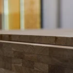 Stack of 20 mm finger-jointed oak furniture panels showing their clean cut edges.