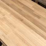 Diagonal view of the finger-jointed oak board showing wood grain.