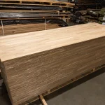 Large pallet with packaged finger-jointed oak panels.