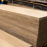 Wrapped stack of 20 mm oak furniture boards ready for shipping.