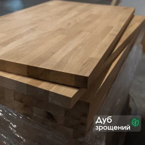 Stacked finger-jointed oak furniture boards with a descriptive text label.