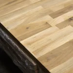 Close-up of the smooth surface and jointed lamellas of the oak furniture board.