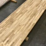 Diagonal view of the long finger-jointed oak panel showing its natural wood pattern.