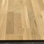 Close-up of the finger-jointed oak board texture showing distinct wood grain patterns.