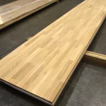 High-angle view showing the full length of the 3x0.62 m finger-jointed oak furniture board.