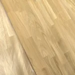 Top-down view of the joined oak lamellas of the finger-jointed furniture panel.