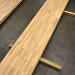 Long finger-jointed oak panel 40 mm thick placed on wooden support blocks.