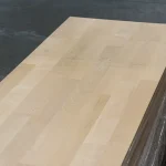 Angled top-down view of the finger-jointed alder panel, highlighting the neat joints and uniform light color.
