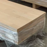 Palletized stack of Grade 1 finger-jointed alder boards wrapped in stretch film.