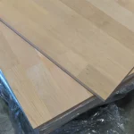 Overlapping finger-jointed alder panels highlighting their uniform light wood tone.