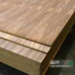 Veneered chipboard American Walnut 19 mm sheets stacked in a warehouse