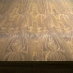 Texture of sawn American Walnut veneer on a chipboard sheet