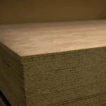 Edge of veneered chipboard American Walnut showing 19 mm thickness