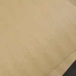 Texture of sliced white ash veneer on chipboard panel