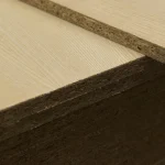 Edges of 19 mm veneered chipboard sheets close up