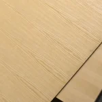 Surface of chipboard faced with sliced white ash veneer