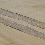 Edge view of exclusive 3D Rough Cut oak veneer sheets showing material thickness