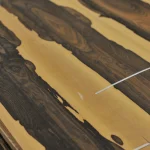 Contrast stripes on the cut of exclusive ziricote veneer