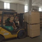 Komatsu forklift moving pallets at the WoodWay Expert veneer warehouse