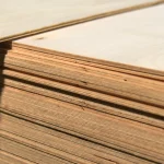 Edges of FC plywood sheets showing 5 mm thickness in a stack