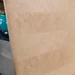 Texture of birch veneer on a 13 mm B/B grade plywood sheet.