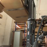 Forklift moving a pallet of 19 mm birch veneered plywood