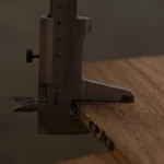 Precise thickness measurement of 10 mm American walnut veneered plywood sheet.