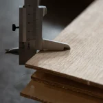 Measuring 5 mm thickness of veneered plywood with a caliper