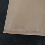 Edge and layers of white ash veneered plywood
