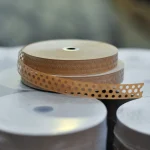 Rolls of brown perforated gummed tape at the WoodWay Expert warehouse