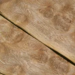 Two sheets of oak burl veneer placed diagonally to demonstrate the pattern.