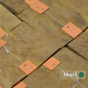 Myrtle burl veneer sheets bundled with orange tags and white strings.