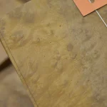 Detailed texture of Myrtle burl veneer showing natural root growth patterns.