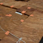 Sheets of Vavona burl veneer laid out in the warehouse